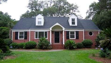 brick ranch houses with dark red metal roofs|metal roof for brick house.